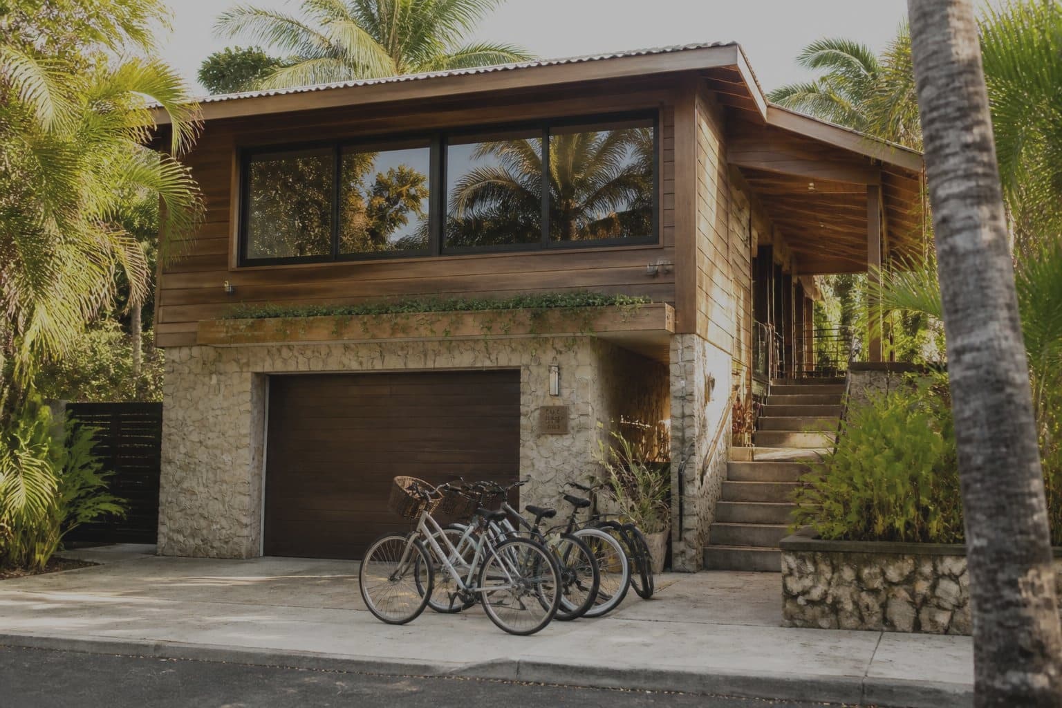 The Tiki Home exterior before photo enhancement, darker and less clear
